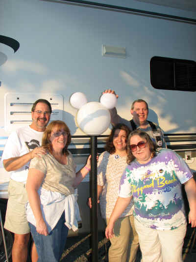 The dinner gang posing beside our motorhome and my wonderful Mickey lamp!